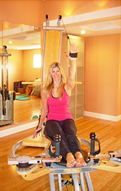 WORKING OUT: “This is something that I love. It’s wonderful when you can do something you love and that makes you and others feel good. You feel renewed and revitalized after a Gyrotonic® work-out.” Kristen Thompson, owner of KAT movement — Gyrotonic® on State Road, is shown working out on the pulley trainer, Gyrotonic’s main piece of equipment.