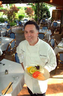 DINING OUT: “We like to offer comfort food. We have larger portions, with an attractive, straightforward presentation. Our food is from different cultures, and we take the best features of each, and come up with a unique cuisine.” Chef/co-owner Mark Valenza of Za Restaurant in Pennington is shown in the popular Wisteria Garden, which offers al fresco dining in warm weather.