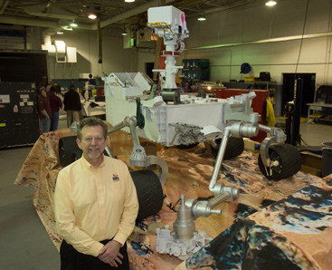 NASA EXPERT SPEAKS ON PLANETARY SCIENCE: Jim Green, of the Planetary Systems Division at NASA Headquarters in Washington, in front of a replica of the Mars Curiosity Rover during the assembly of the NASA float that took part in the inaugural day parade in honor of President Barack Obama last Saturday. Mr. Green will speak at a meeting of the Amateur Astronomers Association of Princeton on Monday, February 4.(Photo by NASA/Paul E. Alers)