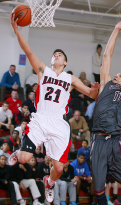 TRENDING UP: Hun School boys’ basketball star Fergus Duke flies to the hoop for a lay-up in recent action. Last Saturday, senior guard Duke scored a team-high 19 points as Hun topped Mercersburg Academy (Pa.) 74-62 to win its fifth game in a row and improve to 12-3. The Raiders host East Brunswick on January 26 and Life Center Academy on January 29. (Photo by Frank Wojciechowski)