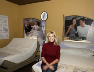 BEST BEDS: “The addition of the mattresses, headboards, and pillows has been a nice way of diversifying what we have. It’s a perfect fit for our business, and brings in our existing customers as well as new ones.” Debbie Schaeffer, President and CEO of Mrs. G TV • Appliances • Sleep Center, is pictured in the showroom, where 16 beds are on display.