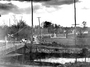 VINTAGE KINGSTON: Lincoln Highway at the D&R Canal, Kingston. While much has changed since this photograph was taken, the D&R Canal remains as does the red brick building known as the Kingston Mill. Note the billboard in the background for Trenton’s Stacey-Trent Hotel, which opened in 1921 and was demolished in 1967.(Courtesy of Duke University Library Digital Collection)