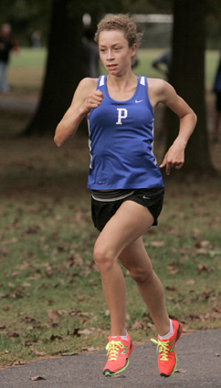 MAKING STRIDES: Princeton High girls’ cross country star Lou Miahle heads to the finish line in a race earlier this season. Last Friday, sophomore Miahle led the way for PHS as the Mercer County Cross Country Championships, clocking a time of 19:42 over the 3.1 mile course at Washington Crossing State Park to take ninth individually. Paced by Miahle, PHS finished second of 15 schools in the team standings, trailing only WW/P-S. Following Miahle for PHS was Mary Sutton in 14th place  with Julie Bond finishing 15th and Paige Metzheiser taking 16th.(Photo by Frank Wojciechowski)