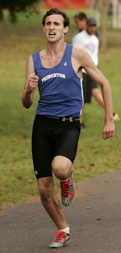 FINAL SPRINT: Princeton High boys’ cross country runner Conor Donahue sprints down the final stretch in a recent race. Last Friday, senior star Donahue placed ninth at the Mercer County Cross Country Championships at Washington Crossing Park, covering the 3.1 mile course in a time of 16:21. Sparked by ­Donahue’s heroics, PHS placed fourth of 18 schools in the team standings, trailing just champion WW/P-S, runner-up Robbinsville, and WW/P-N.(Photo by Frank Wojciechowski)