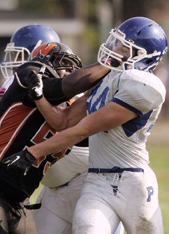 BUCK SHOT: Princeton High junior fullback/linebacker Colin Buckley, right, delivers a shot in recent action. Last Saturday, Buckley and PHS fell 36-5 to visiting Willingboro in their first game on the school’s new turf field. The Little Tigers, now 0-6, play at Burlington Township on October 26.(Photo by Frank Wojciechowski)