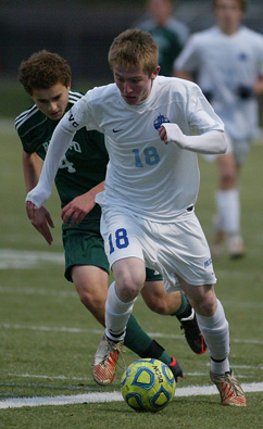 TITLE CHASE: Princeton High boys’ soccer player Chase Ealy controls the ball in 2012 state tournament action. Last Thursday, junior star Ealy scored two goals to help fourth-seeded PHS top No. 5 Hopewell Valley 3-0 in the Group III Central Jersey sectional quarterfinals. The win earned PHS a shot at top-seeded Allentown in the sectional quarters in a game slated for November 12 with the winner advancing to the title game on November 15.(Photo by Stephen Goldsmith)