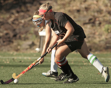 BELLOWING OUT: Hun School field hockey player Francesca Bello, right, goes after the ball in action this fall. Senior Bello provided offensive punch for Hun as it went 6-14 this fall.(Photo by Frank Wojciechowski)