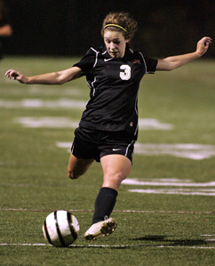 LIVING IT UP: Hun School girls’ soccer player Olivia Braender-Carr boots the ball up the field last Wednesday in the state Prep A championship game. Senior defender Braender-Carr and the sixth-seeded Raiders fought hard in falling 2-0 to top-seeded and 11-time champion Pennington. Last Saturday, NYU-bound Braender-Carr ended her Hun career by picking up an assist as the Raiders topped  Mercersburg Academy (Pa.) 3-0 in their regular season finale to post a 7-12-1 record.(Photo by Frank Wojciechowski)