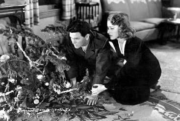 PHILADELPHIA CHRISTMAS 1945: Except for one of the most powerful combat sequences ever filmed, “Pride of the Marines” is set in Philadelphia. Returning from the war blinded and bitter, John Garfield, as real-life hero Al Schmid, has collided with the Christmas tree; here he’s getting the loving support of Ruth, “the girl he left behind,” played with warmth and spirit by Eleanor Parker, who died December 9.