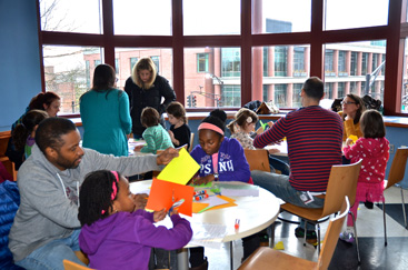 MAKING ART ON A SPECIAL DAY: Parents and children found creative ways to honor Dr. King Monday at the Arts Council of Princeton. The Martin Luther King, Jr. Day Art Workshop was presented by the Arts Council, the Historical Society of Princeton, and the Princeton High School Community Service Group.(Photo by Emily Reeves)