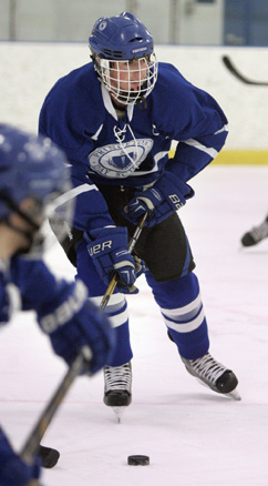 RED LETTER DAY: Princeton Day School boys’ hockey player Sean Timmons moves the puck in recent action. Last Wednesday, Timmons chipped in a goal and two assists as PDS defeated Lawrenceville 6-3. It was the Panthers’ first win over the Big Red since the 2000-01 season. PDS, now 7-3-1, hosts LaSalle Prep (Pa.) on January 22 and Chatham High on January 24 before playing at the Portledge School (N.Y.) on January 27.(Photo by Frank Wojciechowski)