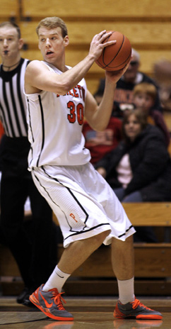 REVENGE FACTOR: Princeton University men’s basketball player Hans Brase looks for an opening in a game earlier this season. Last weekend, sophomore forward Brase starred as Princeton topped Yale 57-46 and beat Brown 69-64. The win over Yale was particularly sweet as it dealt a crucial blow to the Bulldogs’ Ivy League title hopes and ended Princeton’s three-game losing streak in the series. The Tigers, now 17-8 overall and 5-6 Ivy, play at Cornell on March 7 and at Columbia on March 8 before hosting Penn on March 11.(Photo by Frank Wojciechowski)