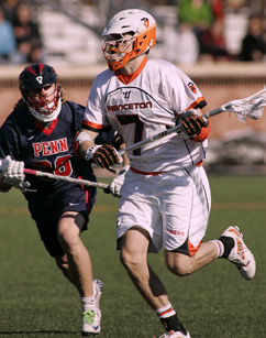 TOUGH TO BEAR: Princeton University men’s lacrosse player Tucker Shanley heads up the field in recent action. Last Saturday, senior midfield Shanley scored a goal in a losing cause as Princeton fell 11-10 at Brown. The defeat to the Bears dropped the Tigers to 4-4 overall and 1-2 Ivy League. Princeton, now ranked 19th nationally, will look to get back on the winning track when it hosts Rutgers (6-4) on April 5 in the annual showdown for the Meistrell Cup.(Photo by Frank Wojciechowski)