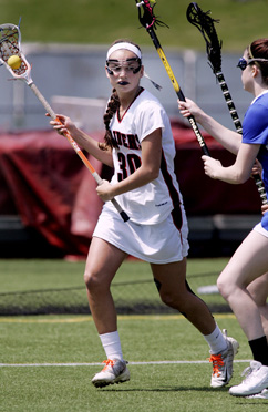 STICKING WITH IT: Hun School girls’ lacrosse star Bri Barratt eludes the Mercersburg Academy (Pa.) defense last Saturday. Senior star and Syracuse-bound Barratt scored four goals in the game but it wasn’t enough as Hun lost 20-13. The Raiders, now 1-10, are slated to wrap up their season by playing at the Pennington School on April 30.(Photo by Frank Wojciechowski)