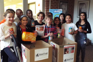 FOOD FOR THE HUNGRY: Fifth grade students help load boxes for delivery to HomeFront in response to a food drive that challenged the entire Middle School of Princeton Day School. The school has a long-standing relationship with HomeFront.