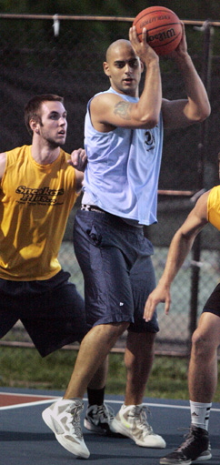 STANDING TALL: Mark Aziz of Ivy Inn, right, establishes inside position against Bobby Brackett of Sneakers Plus in last year’s championship series in the Princeton Recreation Department Summer Men’s Basketball League. Ivy Inn swept the series 2-0 and Aziz was named as Foreal Wooten Playoff MVP. The league tips off its 26th season on June 11 with a triple-header at the Community Park courts.(Photo by Frank Wojciechowski)