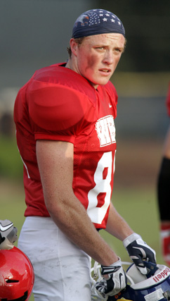 SHINING MOMENT: Liam Helstrom takes a break on the sideline last week at the Sunshine Classic all-star football game played at The College of New Jersey. Former Princeton High star Helstrom made two catches for 42 yards for the West team but it wasn’t enough as the East prevailed 14-7. It was the last game of organized football for Helstrom, who is headed to Clemson University this fall.(Photo by Frank Wojciechowski)