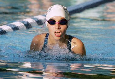 CATCHING HER BREATH: Eva Petrone of the Community Park Bluefish swim team competes in a breaststroke event earlier this summer. Last week, Petrone took fifth in the 12-and-under 50 backstroke and 10th in the 50 breaststroke at the Princeton Area Swimming and Diving Association (PASDA) championships. The Bluefish placed third of six clubs in the Division 1 team standings at the meet. (Photo by Frank Wojciechowski)