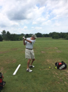 HOGAN’S ALLEY: Princeton resident Bill Hogan displays his form on the driving range at the Bedens Brook Club in Skillman. Hogan, who turns 76 this week, averaged 200 rounds of golf a year from 2004-2013 and achieved the feat of a golfing lifetime last December when he shot a round lower than his age, carding a 73.(Photo Courtesy of Bedens Brook Country Club)