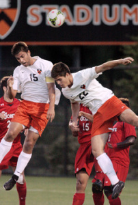 HEAD GAMES: Princeton University men’s soccer players, Andrew Mills. left, and Thomas Sanner use their heads during Princeton’s scoreless draw with St. John’s last Wednesday. The Tigers, who edged Seton Hall 5-4 last Sunday to improve to 1-1-1, host Georgetown on September 17 in a game to be televised on ESPNU before playing at Boston University on September 20.(Photo by Frank Wojciechowski)