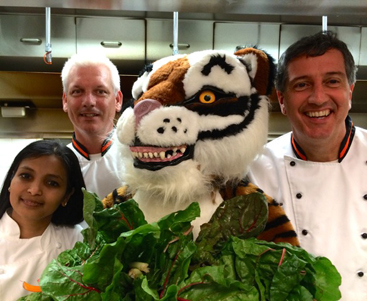 EAT YOUR VEGETABLES: Garden State on Your Plate brings Princeton University chefs to local elementary schools this month to help educate children about appreciating locally grown produce. Adorned in chard grown by Jess Niederer of Chicadee Creek Farm in Pennington, the Princeton Tiger is joined by Smitha Haneef, executive director of campus dining; Rob Harbison, executive chef; and Brad Ortega, chef manager.