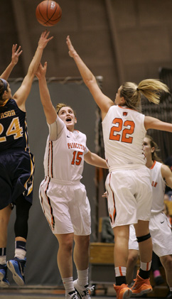 DEPARTMENT OF DEFENSE: Princeton University women’s basketball players, Annie Tarakchian (No. 15) and Taylor Williams (No. 22) turn up the defensive pressure on a Drexel player last Wednesday at Jadwin Gym. The Tigers topped Drexel 59-43 in their home opener. Last Sunday, junior forward Tarakchian came up big for the Tigers, posting the team’s first double-double of the season with 13 points and 11 rebounds in a 63-56 win at American University. Princeton, now 4-0, will head to Mexico this week to compete in the 2014 Cancun Challenge.(Photo by Frank Wojciechowski)