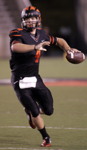 FINAL PUSH: Princeton University senior quarterback Quinn Epperly gets ready to fire the ball in recent action. Last Saturday, Epperly rushed for three touchdowns in a losing cause as Princeton fell 44-30 at Yale. The defeat dropped the Tigers to 5-4 overall and 4-2 Ivy League, thereby extinguishing their hopes for a second straight Ivy title with Harvard leading the pack at 9-0 overall, 6-0 Ivy followed by Yale (8-1 overall, 5-1 Ivy) and Dartmouth (7-2 overall, 5-1 Ivy) as the teams head into the last week of the season. Princeton hosts Dartmouth on November 22 in its season finale.(Photo by Frank Wojciechowski)