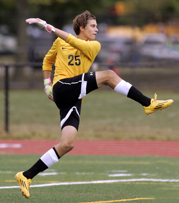 MULTI-TASKING: Princeton High boys’ soccer goalie Laurenz Reimitz follows through on a kick in a game earlier this season. Last Wednesday, senior Reimitz came up big as second-seeded PHS topped third-seeded Steinert on penalty kicks in the Mercer County Tournament semifinals after the rivals battled to a 1-1 tie through regulation and two overtimes. Reimitz made some key saves in the first overtime and stopped a penalty kick in the shootout before booting in the clinching PK himself. On Saturday in the MCT title game, he made four saves as PHS edged top-seeded Allentown in another shootout as the teams were tied at 1-1 after regulation and two overtimes. (Photo by Frank Wojciechowski)