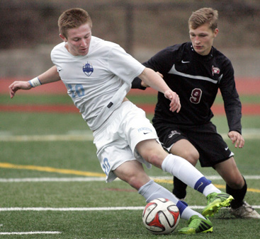 TITLE CHASE: Princeton High boys’ soccer player Chase Ealy controls the ball during PHS’s 4-1 win over Red Bank Regional in the Central Jersey Group 3 sectional title game. Last Sunday in Group 3 state championship game against South Plainfield, senior star and co-captain Ealy scored a goal but it wasn’t enough as PHS fell 4-3. The loss left the Little Tigers with a final record of 18-3-2.(Photo by Frank Wojciechowski)