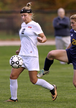 TITLE CHASE: Hun School girls’ soccer player Ashley Maziarz, left, chases down a ball last Thursday against Peddie in the state Prep A semifinals. Senior star and Lehigh-bound Maziarz contributed a goal as top-seeded Hun topped No. 5 Peddie 4-1. Hun, now 12-4-1, hosts second-seeded and perennial Prep A champion Pennington in the title game on November 5.(Photo by Frank Wojciechowski)