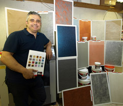 DECORATIVE DESIGN: “We import the finest Italian plasters and decorations,” says Antonio Ramondini, founder and owner of AR Building Technologies. He is shown with a sampling of the San Marco line of Italian plasters and decorative finishes, suitable for use on walls and ceilings.