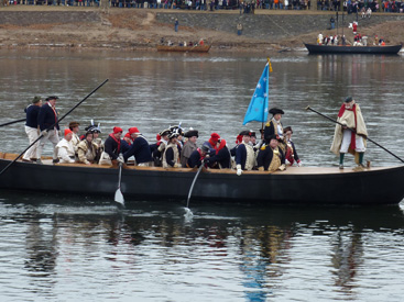 DURHAM BOATS AWAY: General Washington’s Continental Army will again cross the Delaware River from Pennsylvania into New Jersey this Christmas Day. And if weather permits, there will be smooth passage as in this scene photographed a few years ago. But you don’t have to wait until Christmas Day to see the action. A full dress rehearsal of the reenactment is scheduled for this Sunday, December 7, at 1 p.m. Unlike the free event on Christmas Day, however, there is an admission charge for the dress rehearsal, with proceeds benefiting programs at Washington Crossing State Park, where the event takes place. For more information, visit: www.WashingtonCrossingPark.org.(Photo by L. Arntzenius)