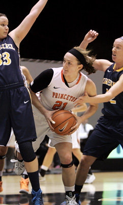 INSIDE PRESENCE: Princeton University women’s basketball player Alex Wheatley, center, fights for inside position in a recent game. Last Saturday, junior forward Wheatley scored 17 points and had eight rebounds and three assists to help Princeton top Georgetown 83-54. The Tigers improved to 8-0 with the victory, the best start in the history of Ivy League women‘s basketball. In upcoming action, Princeton was slated to play at Michigan on December 9 before hosting Binghamton on December 13.(Photo by Frank Wojciechowski)