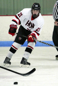 BENDING IT IN: Hun School boys’ hockey player Jon ­Bendorf tracks the puck in a game earlier this season. Last Thursday, sophomore Bendorf scored a dazzling end-to-end goal to help Hun defeat the Princeton Day School 6-1. The Raiders, now 6-0-1, are next in action when they play in the Purple Puck Tournament in the Washington, D.C. area from December 28-31.(Photo by Frank Wojciechowski)