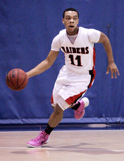 WILLING AND ABLE: Hun School boys’ basketball player Eric Williams dribbles upcourt in a game last season. The Raiders will be looking to senior Williams to have a big year as they look to improve on the 8-13 record posted last winter. Hun tips off its 2014-15 campaign by hosting the Phelps School (Pa.) on December 4.(Photo by Frank Wojciechowski)