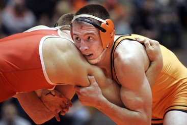 LOCKED IN: Princeton University wrestler Brett Harner, right, battles a foe in a bout last season. Last week, sophomore Harner took eighth place at 184 pounds in the prestigious Midlands Championships at Northwestern. The Tigers have a pair of home matches on January 9 as they welcome Sacred Heart and Hofstra to Dillon Gym.(Photo by Frank Wojciechowski)