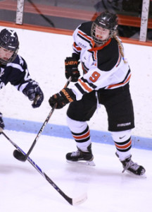 HEALTHY RETURN: Princeton University women’s hockey player Molly Contini battles a foe from Yale last Friday. Sophomore forward Contini scored a goal and an assist in the game as Princeton prevailed 4-1. A day later, Contini, who was sidelined last year due to a hip operation,  tallied two goals and an assist to help the Tigers defeat Brown 5-1. Princeton, 10-9-1 overall and 8-6 ECAC Hockey, is currently on exam break and will return to action on January 26 when it plays at No. 1 Boston College.(Photo by Frank Wojciechowski)