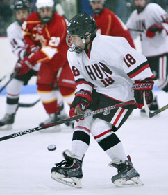 PURPLE HEART: Hun School boys’ hockey player Frankie ­Vitucci chases down the puck in a game earlier this season. Last week, freshman forward Vitucci helped Hun win the Purple Puck Tournament in the Washington, D.C. area. The Raiders topped host Gonzaga in a shootout in the championship game and Vitucci was named the tournament MVP. Hun, now 10-1-1, plays at St. Joseph’s Prep (Pa.) on January 7 and at the Portledge School (N.Y.) on January 12.(Photo by Frank Wojciechowski)