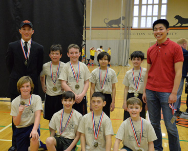 WORKING OVERTIME: Members of the Woodwinds team celebrate after their 66-63 win in four overtimes against Mason, Griffin & Pierson in the championship game of the 4th/5th grade boys’ division of the Princeton Recreation Department’s Dillon Youth Basketball League last Saturday. Jaxson Petrone scored 28 points and Gabe Majeski added 15 as Woodwinds rallied from 17 points behind in the fourth quarter to force overtime and eventually pull out the contest. William Doran scored a Dillon League record 53 points in the loss. Pictured in the front row, from left, are Gabe Majeski, Nicholas Bazarko, Nicola Carusone, and Quinn Ramsay. In the back row, from left, are coach Brandon Yao, Max Blecher, Jaxon Petrone, Nicholas Zahn, Mathew Land, and coach Benjamin Tso. For more details on the Dillon title games, see the item elsewhere on this page.