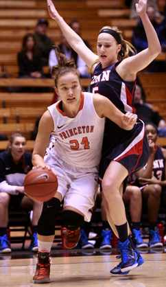 MILLER’S TIME: Princeton University women’s basketball player Michelle Miller fights around a defender in recent action. Last Saturday, junior guard Miller contributed a team-high 20 points to help eighth-seeded Princeton defeat ninth-seeded Wisconsin-Green Bay 80-70 in the first round of the NCAA tournament at College Park, Md. and improve to 31-0. It marked the first-ever win in the NCAA tourney for No. 13 Princeton, which saw its dream season come to an end with an 85-70 loss to top-seeded Maryland last Monday.(Photo by Frank Wojciechowski)