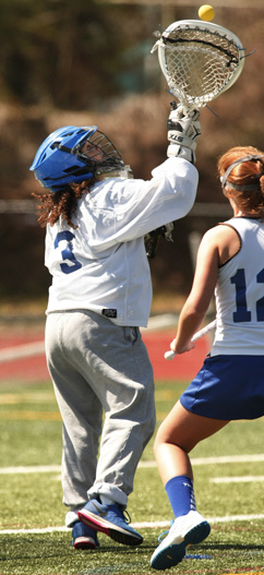 FIRING LINE: Princeton High girls’ lacrosse goalie Mira Shane fires the ball upfield in a game earlier this spring. Last Thursday, senior star and Michigan-bound Shane made 14 saves but it wasn’t enough as ninth-seeded PHS fell 9-8 in overtime to fifth-seeded Hopewell Valley in the North Group 3 sectional semifinals. The loss left the Little Tigers with a final record of 10-13.(Photo by Frank Wojciechowski)