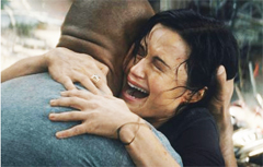 THANK GOD YOU WERE ABLE TO FIND ME: Ray (Dwayne Johnson, left) is embraced by his estranged wife Emma (Carla Gugino) after he came to rescue her from atop a skyscraper in San Francisco that was on the verge of collapsing when the shift in the San Andreas fault triggered a massive earthquake that was felt all over California. (Photo Courtesy of Warner Bros. Picture-©-2015 Warner Bros. Entertainment Inc., WV Films IV LLC and Ratpac-Dune Entertainment LLCâU.S., Canada, Bahamas & Bermuda)